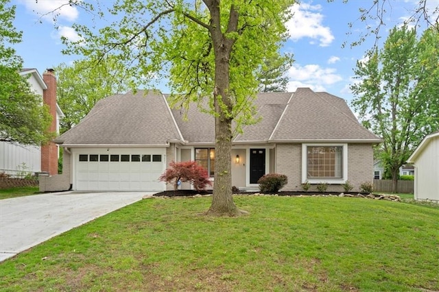 ranch-style home featuring driveway, a front yard, a garage, brick siding, and fence