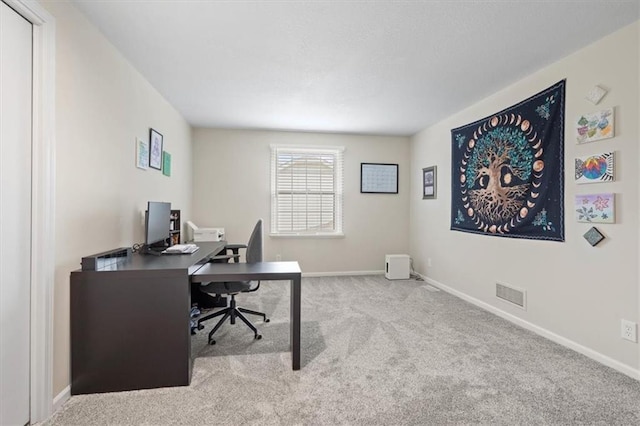 office with visible vents, carpet flooring, and baseboards