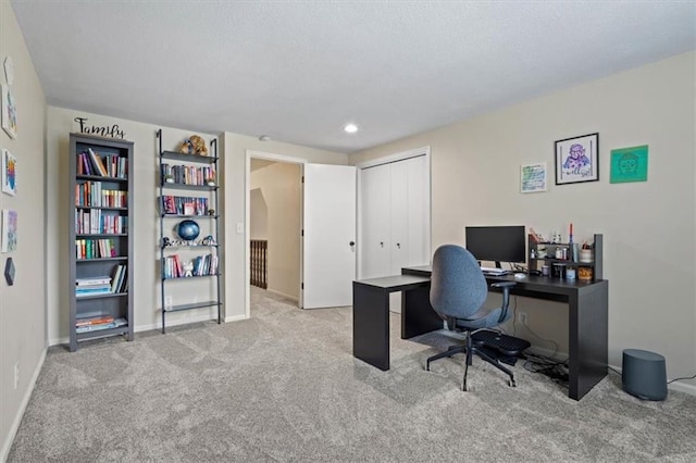 carpeted office space featuring baseboards and recessed lighting