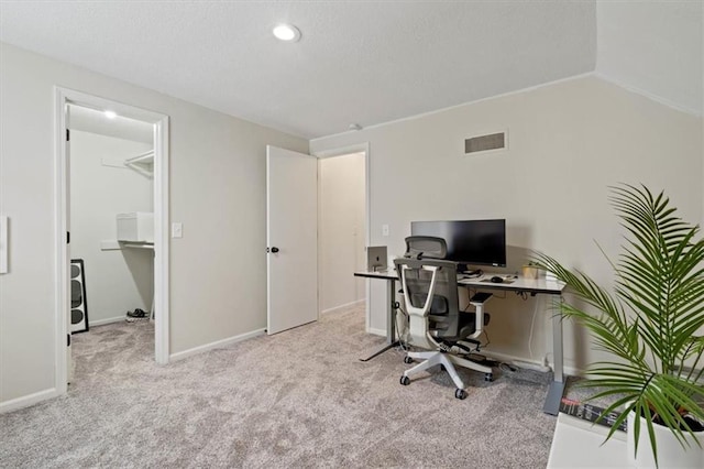 carpeted home office with baseboards and visible vents