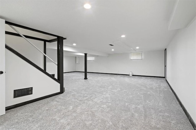 below grade area featuring carpet, recessed lighting, and visible vents