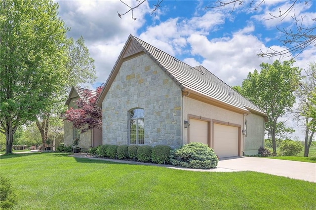 view of side of home with a lawn, a garage, stone siding, and concrete driveway