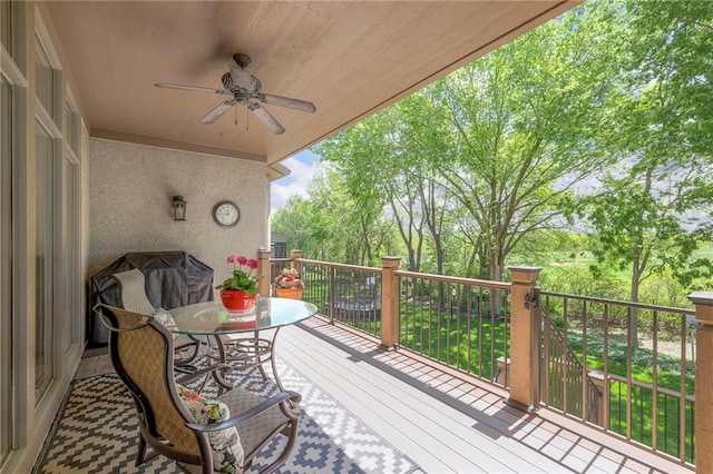 deck featuring ceiling fan and outdoor dining space