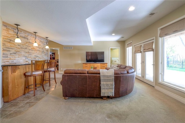 carpeted living room with a bar, recessed lighting, visible vents, and a healthy amount of sunlight