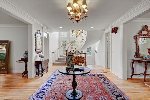11405 Manor St, Leawood, KS 66211 - foyer featuring stairway, a chandelier, wood finished floors, baseboards, and crown molding