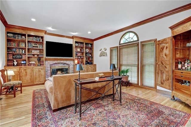 11405 Manor St, Leawood, KS 66211 - living room with crown molding, wood finished floors, a fireplace, built in features, and recessed lighting
