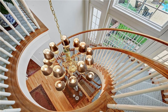 11405 Manor St, Leawood, KS 66211 - staircase with a towering ceiling and a chandelier