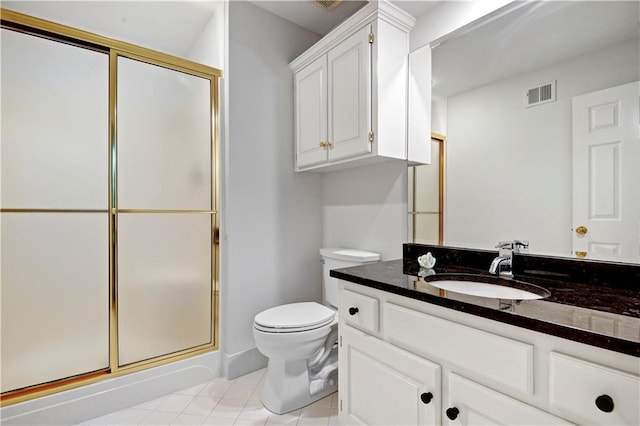 11405 Manor St, Leawood, KS 66211 - full bath featuring a stall shower, toilet, tile patterned floors, and vanity