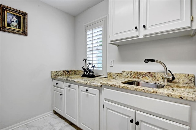 11405 Manor St, Leawood, KS 66211 - laundry area with a sink, light marble finish flooring, and baseboards