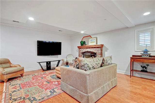 11405 Manor St, Leawood, KS 66211 - living room with baseboards, wood finished floors, a fireplace, and recessed lighting