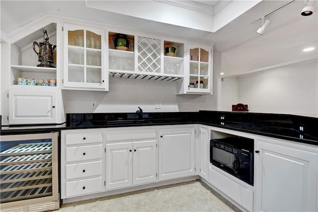 11405 Manor St, Leawood, KS 66211 - kitchen featuring open shelves, wine cooler, black microwave, a sink, and white cabinets