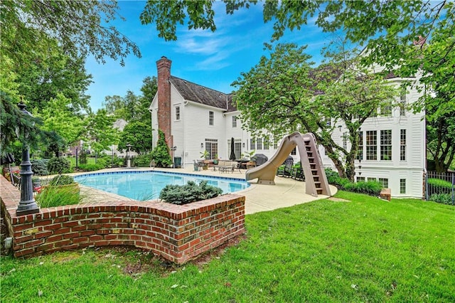 11405 Manor St, Leawood, KS 66211 - view of swimming pool with a water slide and a patio