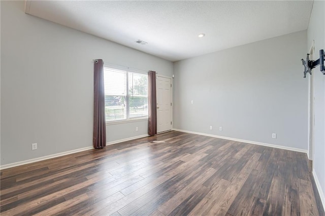 496 S 137th St, Bonner Springs, KS 66012 - spare room featuring dark wood finished floors, baseboards, and recessed lighting