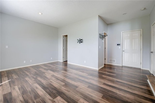 496 S 137th St, Bonner Springs, KS 66012 - empty room with dark wood-type flooring, baseboards, and recessed lighting