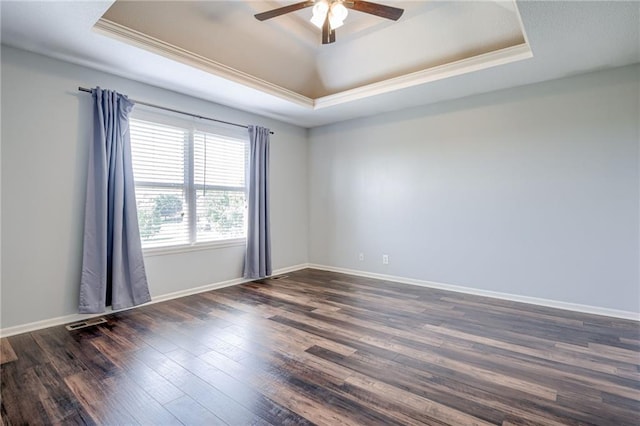 496 S 137th St, Bonner Springs, KS 66012 - spare room featuring a raised ceiling, a ceiling fan, dark wood finished floors, crown molding, and baseboards