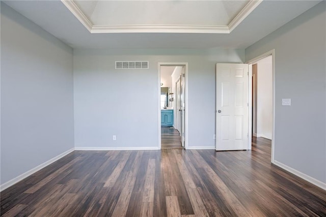 496 S 137th St, Bonner Springs, KS 66012 - unfurnished bedroom featuring a tray ceiling, ornamental molding, dark wood finished floors, and baseboards