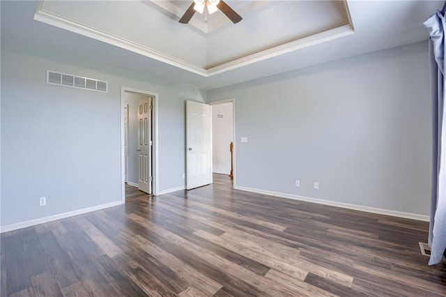 496 S 137th St, Bonner Springs, KS 66012 - spare room featuring a raised ceiling, a ceiling fan, dark wood-style floors, baseboards, and crown molding