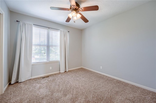 496 S 137th St, Bonner Springs, KS 66012 - carpeted empty room with a ceiling fan, baseboards, and a textured ceiling