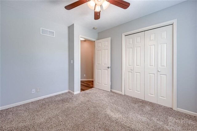 496 S 137th St, Bonner Springs, KS 66012 - unfurnished bedroom featuring carpet flooring, baseboards, a closet, and ceiling fan