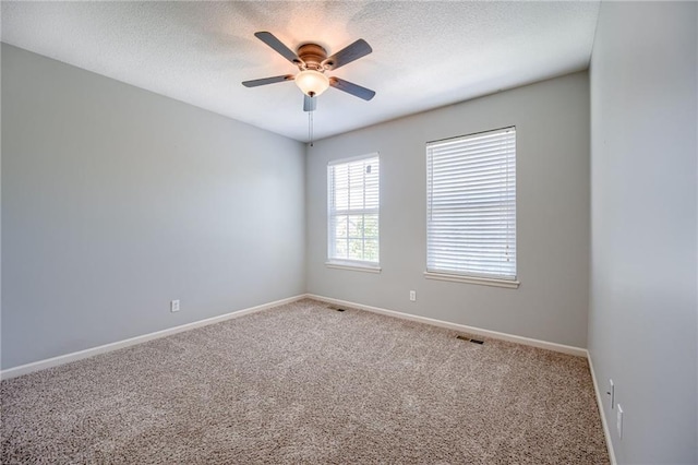 496 S 137th St, Bonner Springs, KS 66012 - carpeted spare room with ceiling fan, a textured ceiling, and baseboards
