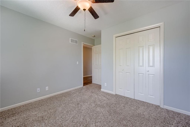 496 S 137th St, Bonner Springs, KS 66012 - unfurnished bedroom featuring carpet, baseboards, a closet, and ceiling fan