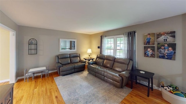 11706 W 69th St, Shawnee, KS 66203 - living room featuring light wood-style flooring and baseboards