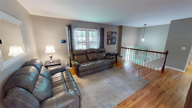 11706 W 69th St, Shawnee, KS 66203 - living area with wood finished floors and baseboards