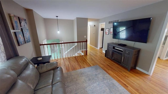 11706 W 69th St, Shawnee, KS 66203 - living area with light wood-type flooring and baseboards