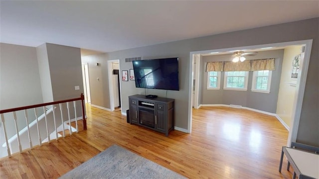 11706 W 69th St, Shawnee, KS 66203 - unfurnished living room featuring light wood finished floors and baseboards