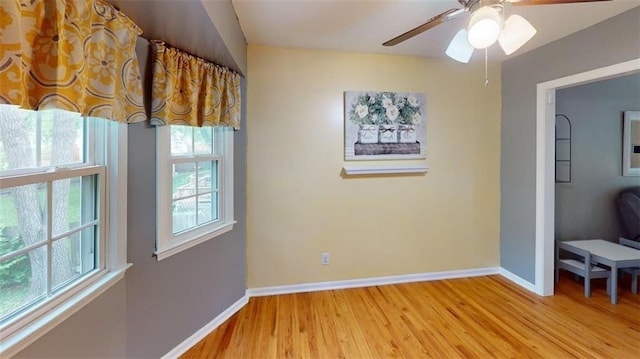 11706 W 69th St, Shawnee, KS 66203 - unfurnished room with light wood-style flooring, baseboards, and a ceiling fan