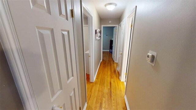 11706 W 69th St, Shawnee, KS 66203 - hallway featuring light wood-style flooring