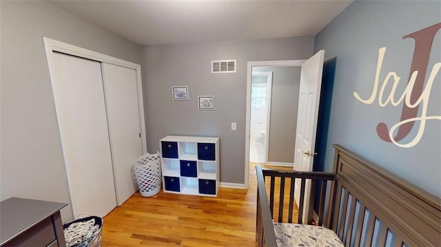 11706 W 69th St, Shawnee, KS 66203 - bedroom with light wood-type flooring and a closet