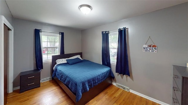 11706 W 69th St, Shawnee, KS 66203 - bedroom with light wood-style floors and baseboards