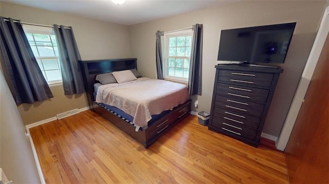 11706 W 69th St, Shawnee, KS 66203 - bedroom featuring light wood-style floors and baseboards