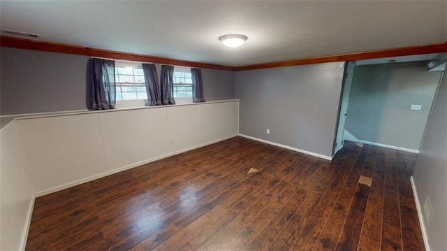 11706 W 69th St, Shawnee, KS 66203 - unfurnished bedroom with wood finished floors, baseboards, and crown molding