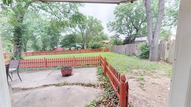 11706 W 69th St, Shawnee, KS 66203 - view of yard with a fire pit and a patio
