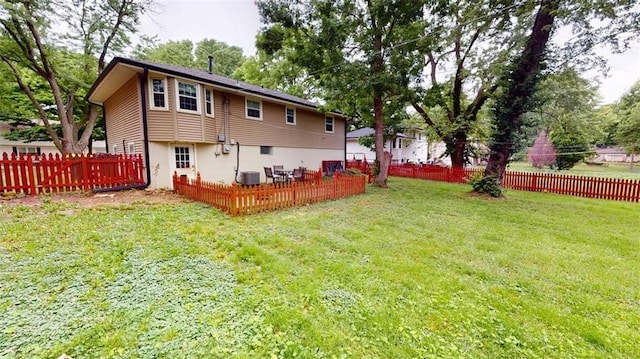 11706 W 69th St, Shawnee, KS 66203 - rear view of house with central AC unit