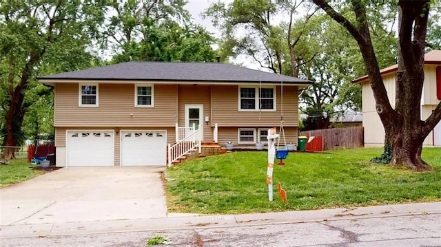 11706 W 69th St, Shawnee, KS 66203 - view of front of home featuring an attached garage and concrete driveway