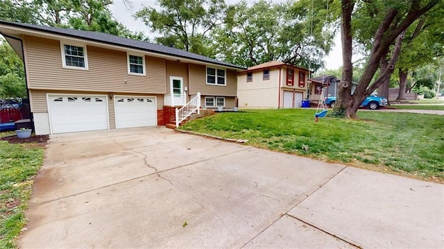 11706 W 69th St, Shawnee, KS 66203 - split foyer home featuring concrete driveway, an attached garage, and a front yard