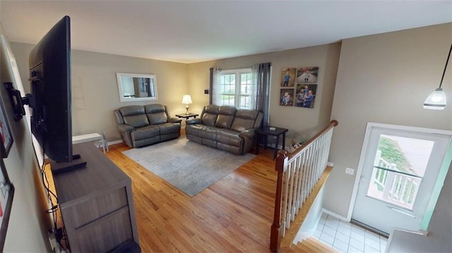 11706 W 69th St, Shawnee, KS 66203 - living area featuring light wood-type flooring and baseboards