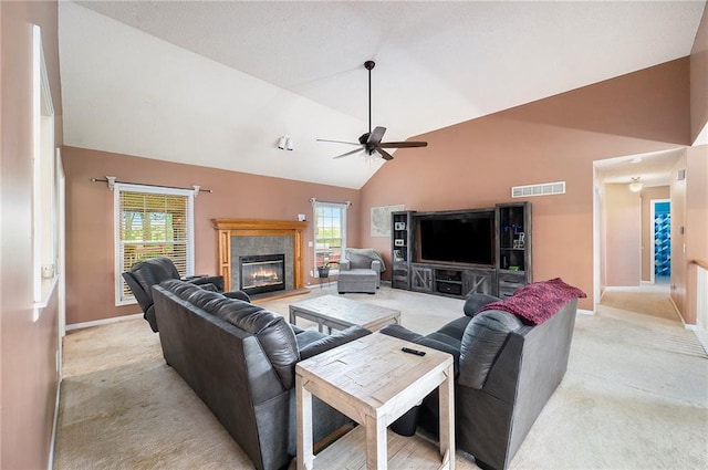 living area with baseboards, visible vents, a ceiling fan, and light colored carpet
