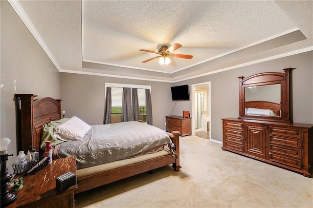 bedroom with crown molding, a textured ceiling, and a raised ceiling
