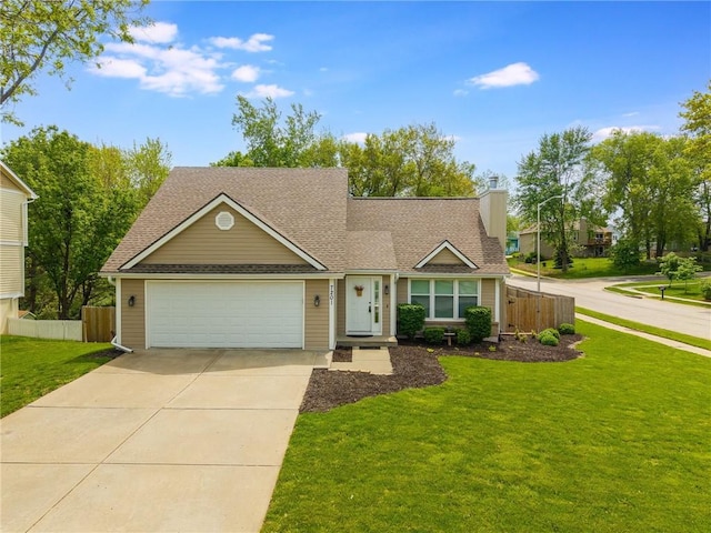 view of front of home with fence, a shingled roof, a front lawn, a garage, and concrete driveway