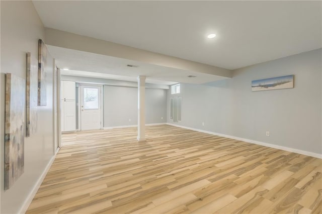 below grade area featuring recessed lighting, baseboards, visible vents, and light wood finished floors
