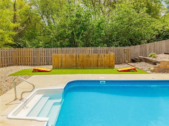 view of pool featuring a fenced in pool, a fenced backyard, and a patio