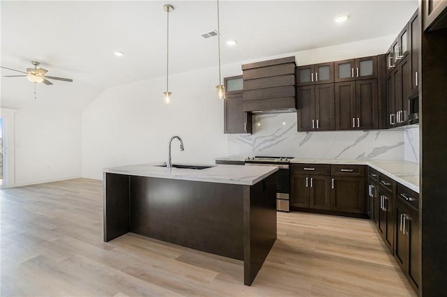 3806-3808 NW 93rd St, Kansas City, MO 64132 - kitchen with appliances with stainless steel finishes, a sink, custom range hood, a ceiling fan, and decorative backsplash