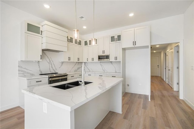 3806-3808 NW 93rd St, Kansas City, MO 64132 - kitchen featuring stainless steel appliances, light wood finished floors, tasteful backsplash, recessed lighting, and light stone counters