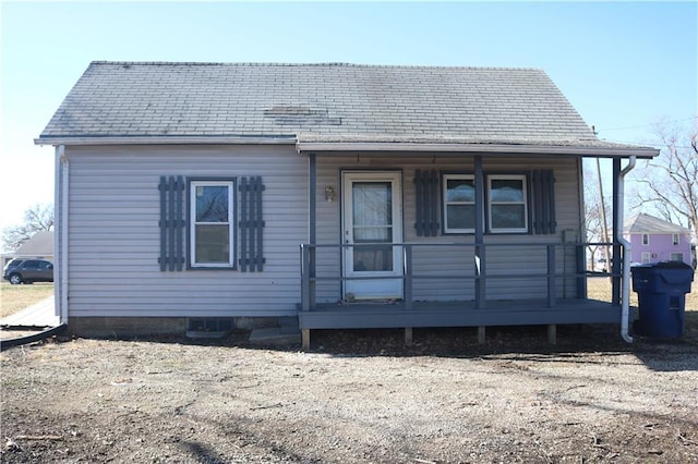 rear view of property with a porch