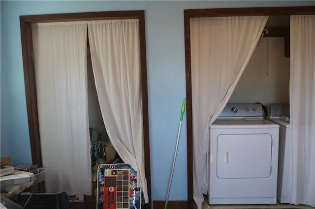washroom featuring washer and clothes dryer and laundry area