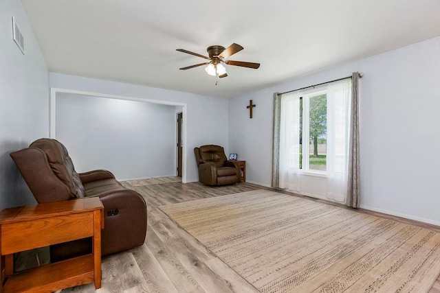34701 E 235th St, Pleasant Hill, MO 64080 - sitting room with visible vents, a ceiling fan, baseboards, and wood finished floors